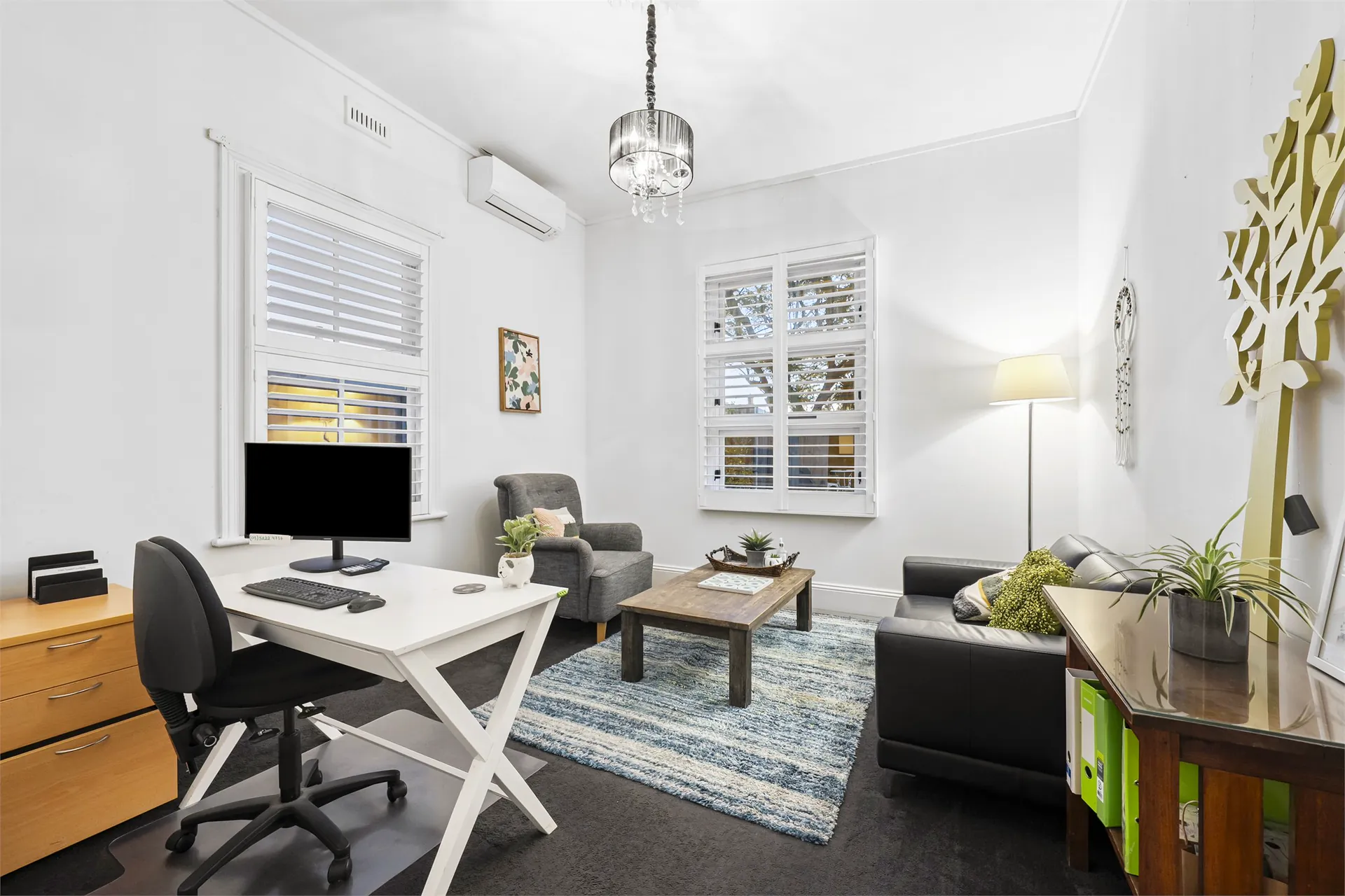 Workplace team meeting together in a bright office